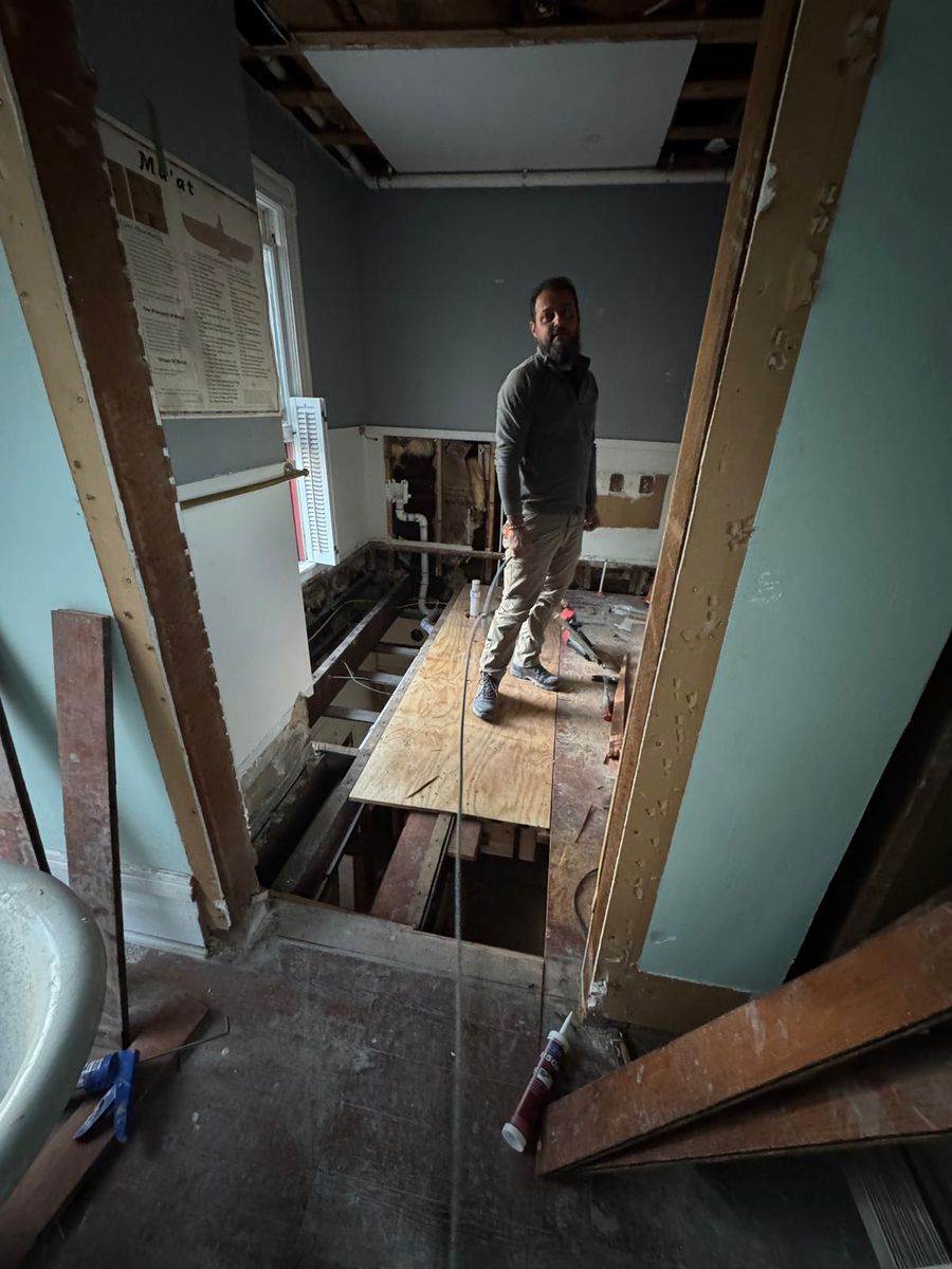 Opening up walls and floors inside the house.
