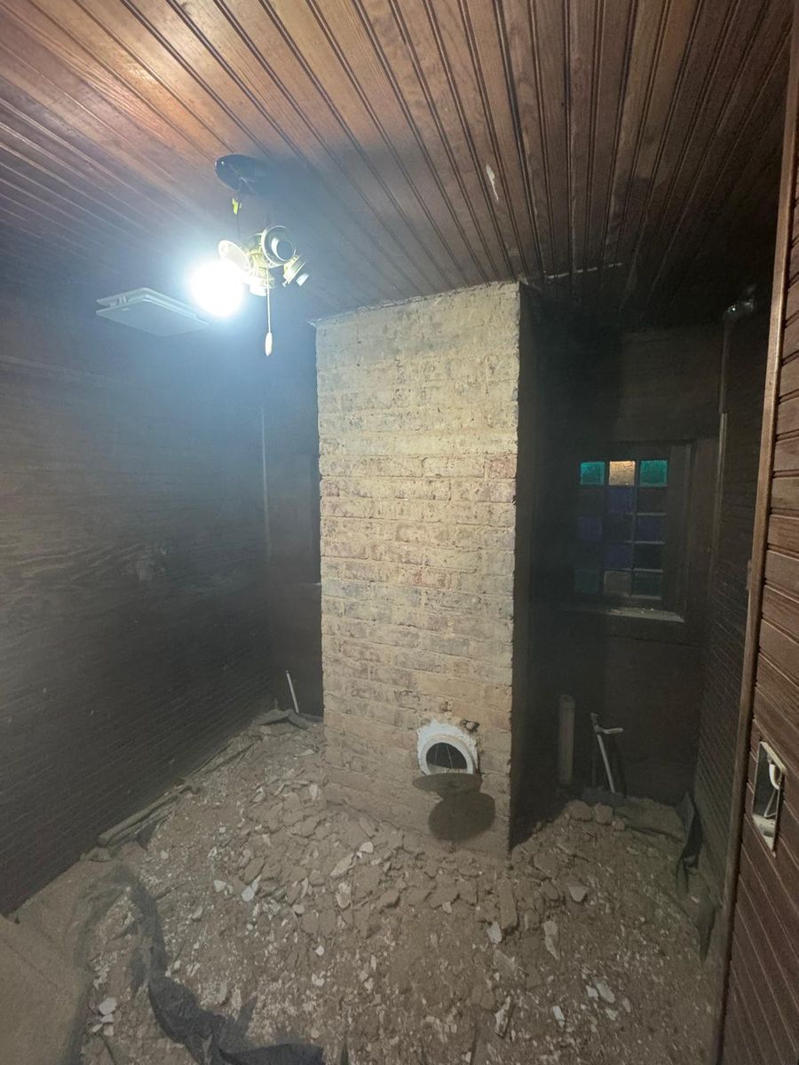 An interior room taken down to the original brick.