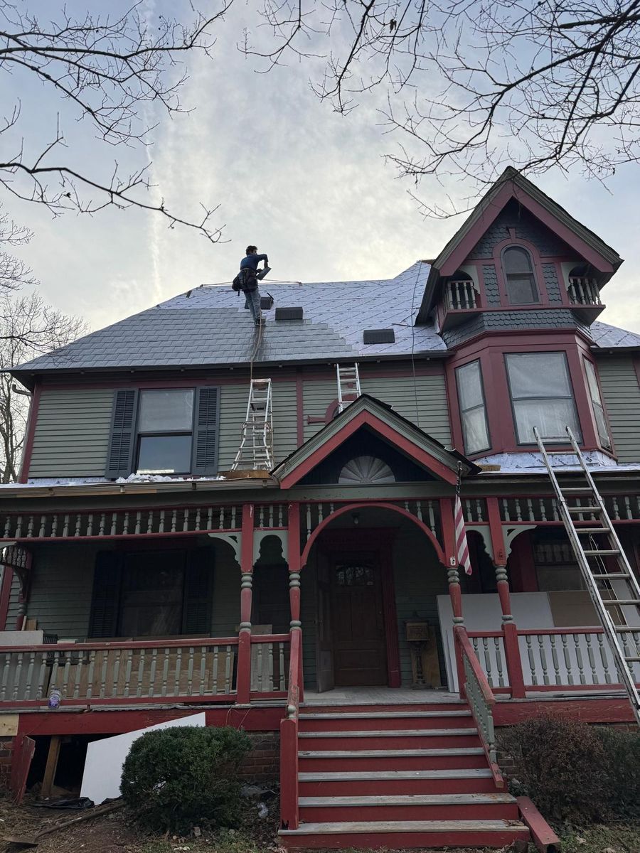 Roof work above the front porch.
